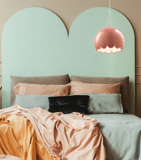 Bedroom with Light Green Backboard and Hanging Light